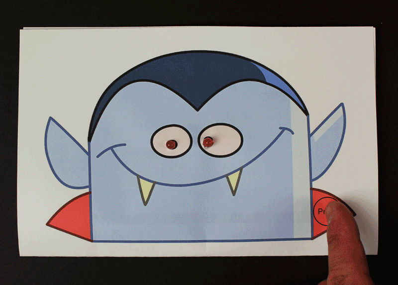 Spooky vampire greeting card with light up eyes.