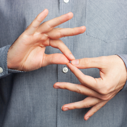 Person's hands signing in ASL